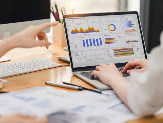 Laptop displaying marketing analytics charts