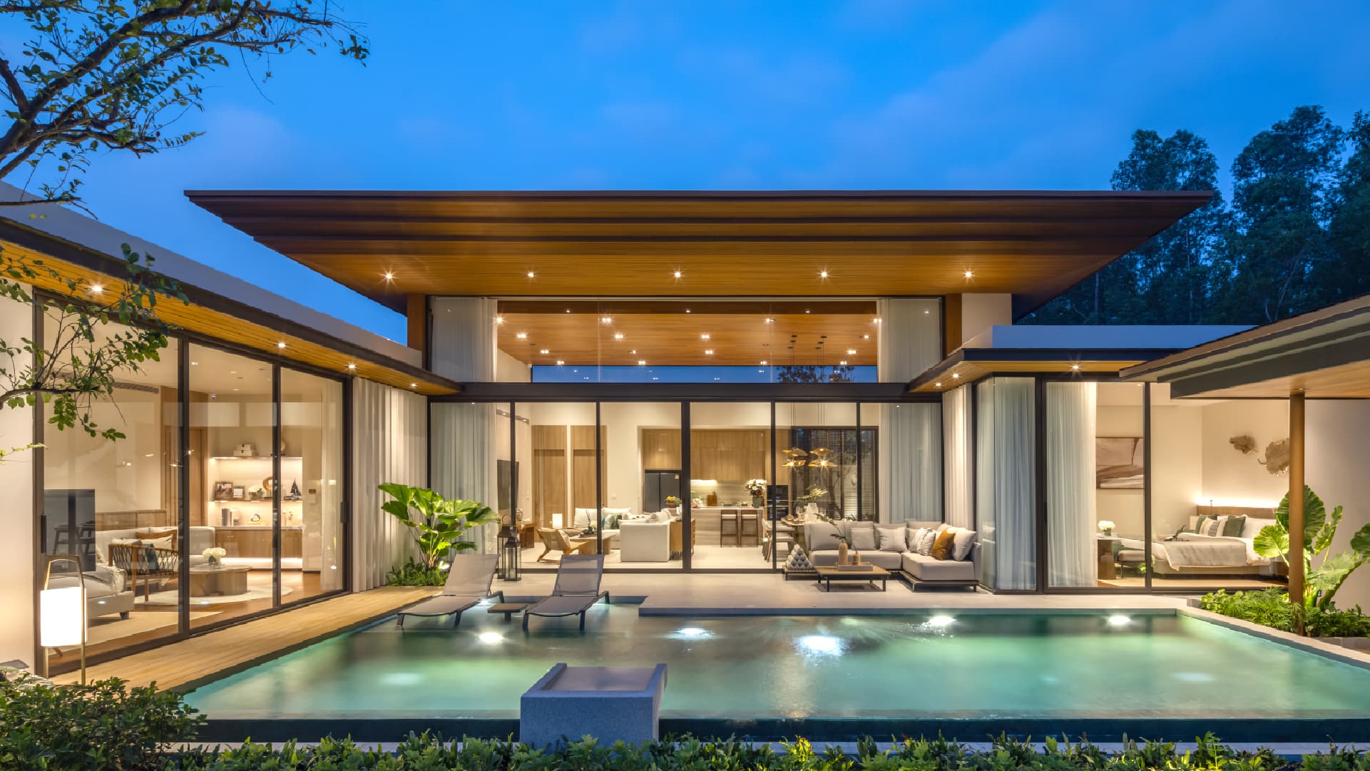 Wooden pavilion overlooking a still pool at a luxury estate