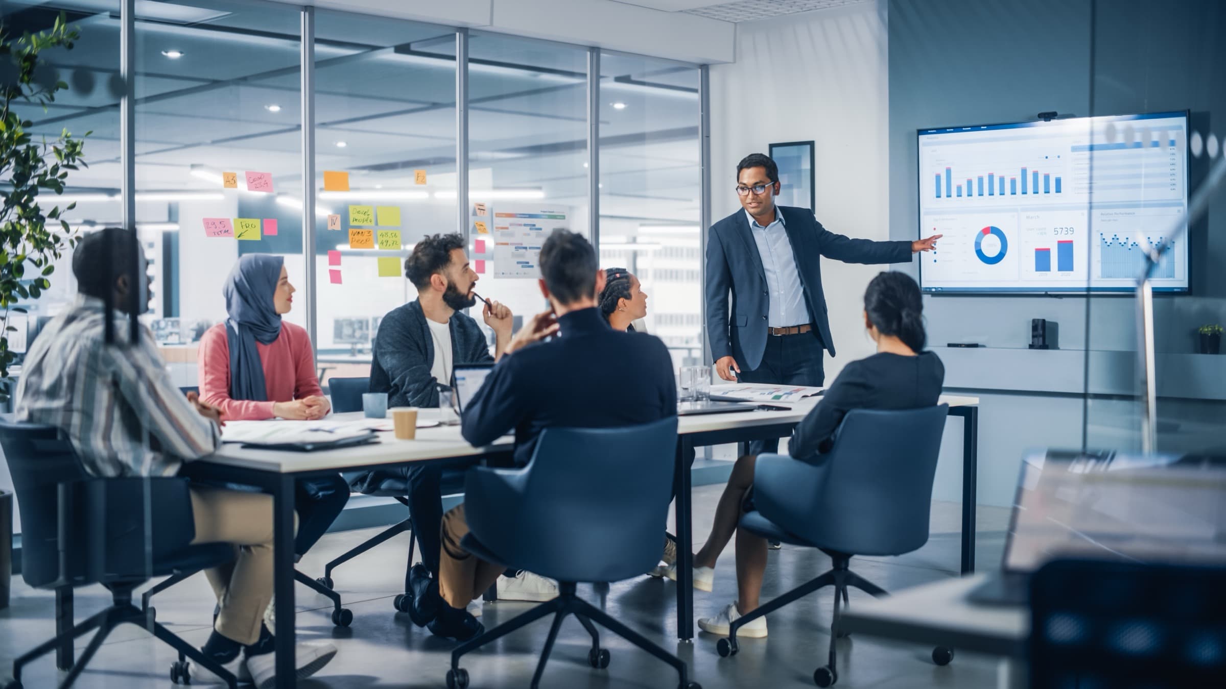 Team presenting marketing analytics in a modern boardroom